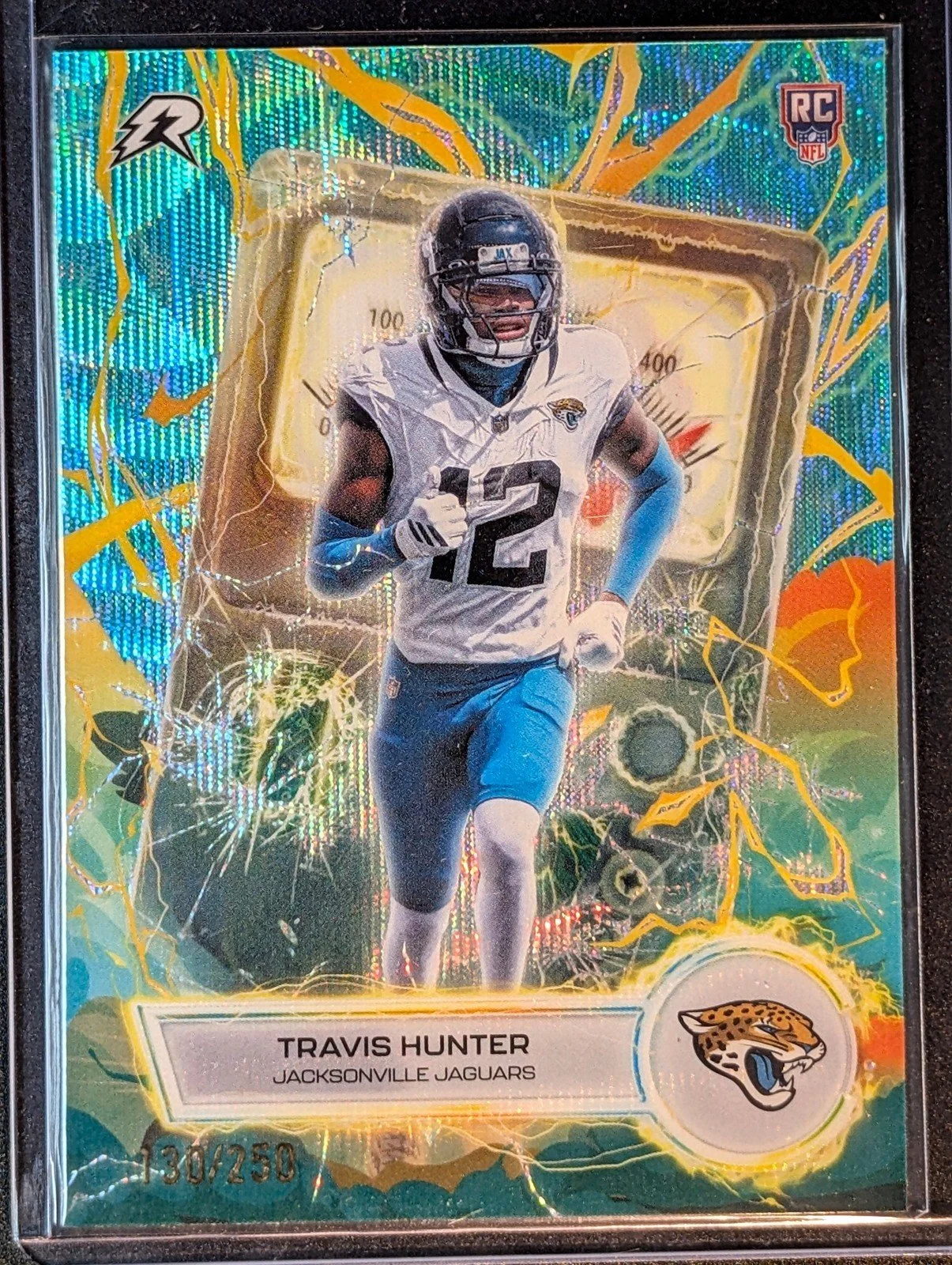 Front of 2025 Topps Resurgence /250 #VT-13 Travis Hunter Voltaic Aqua Surge Refractor