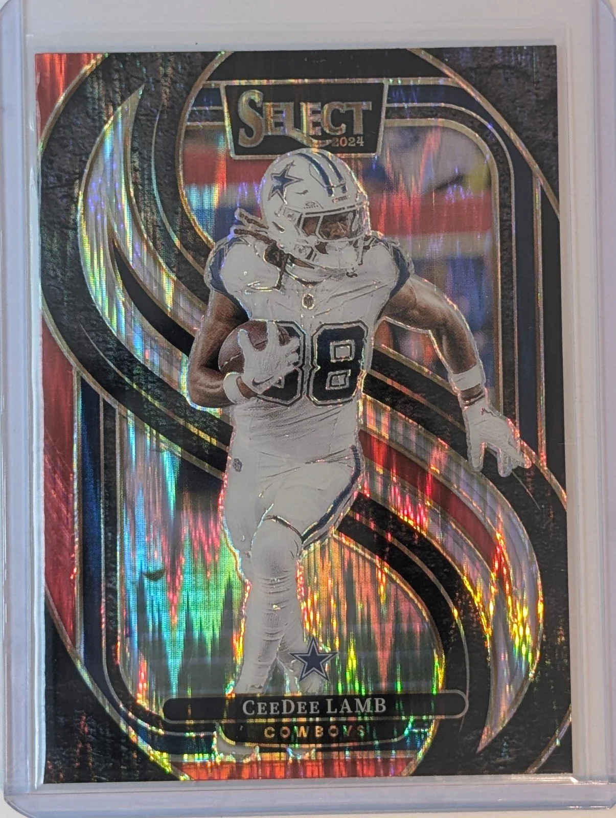 Front of 2024 Panini Select #135 CeeDee Lamb Black & Red Prizm Shock