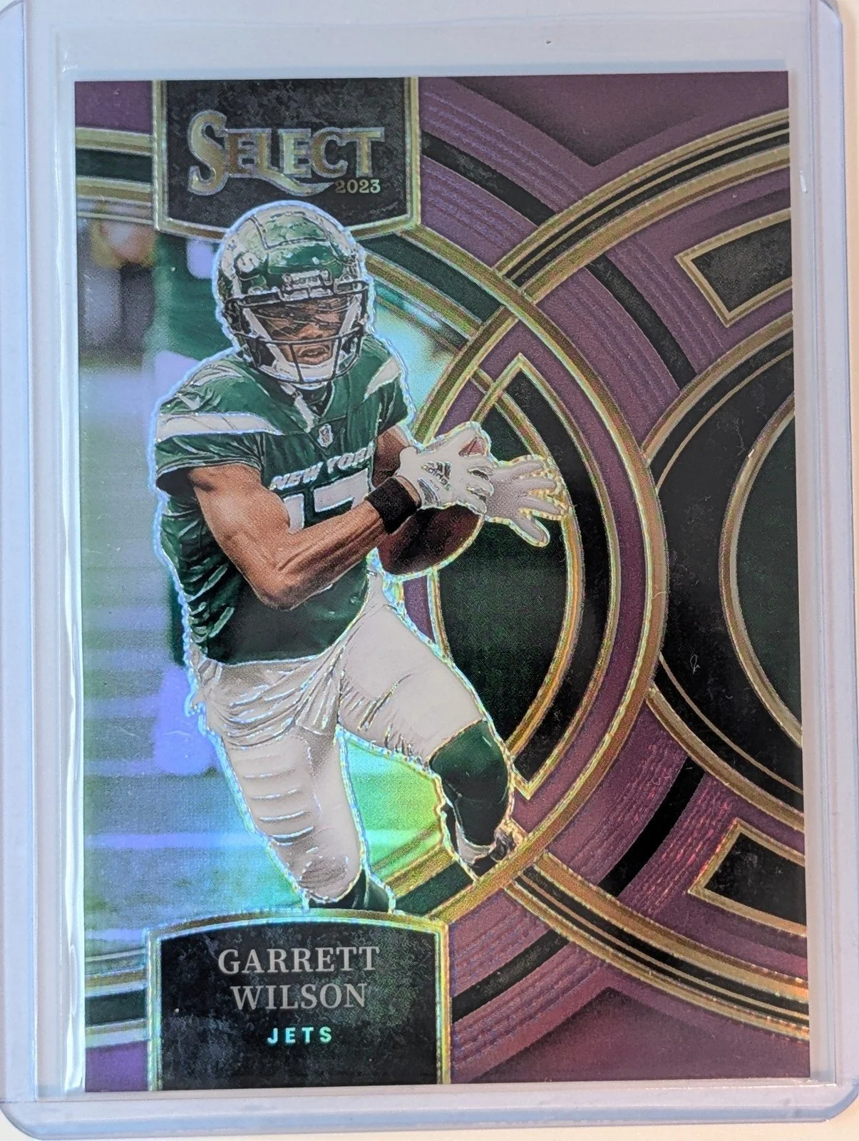 Front of 2023 Panini Select 44/75 #115 Garrett Wilson Purple Prizms /75