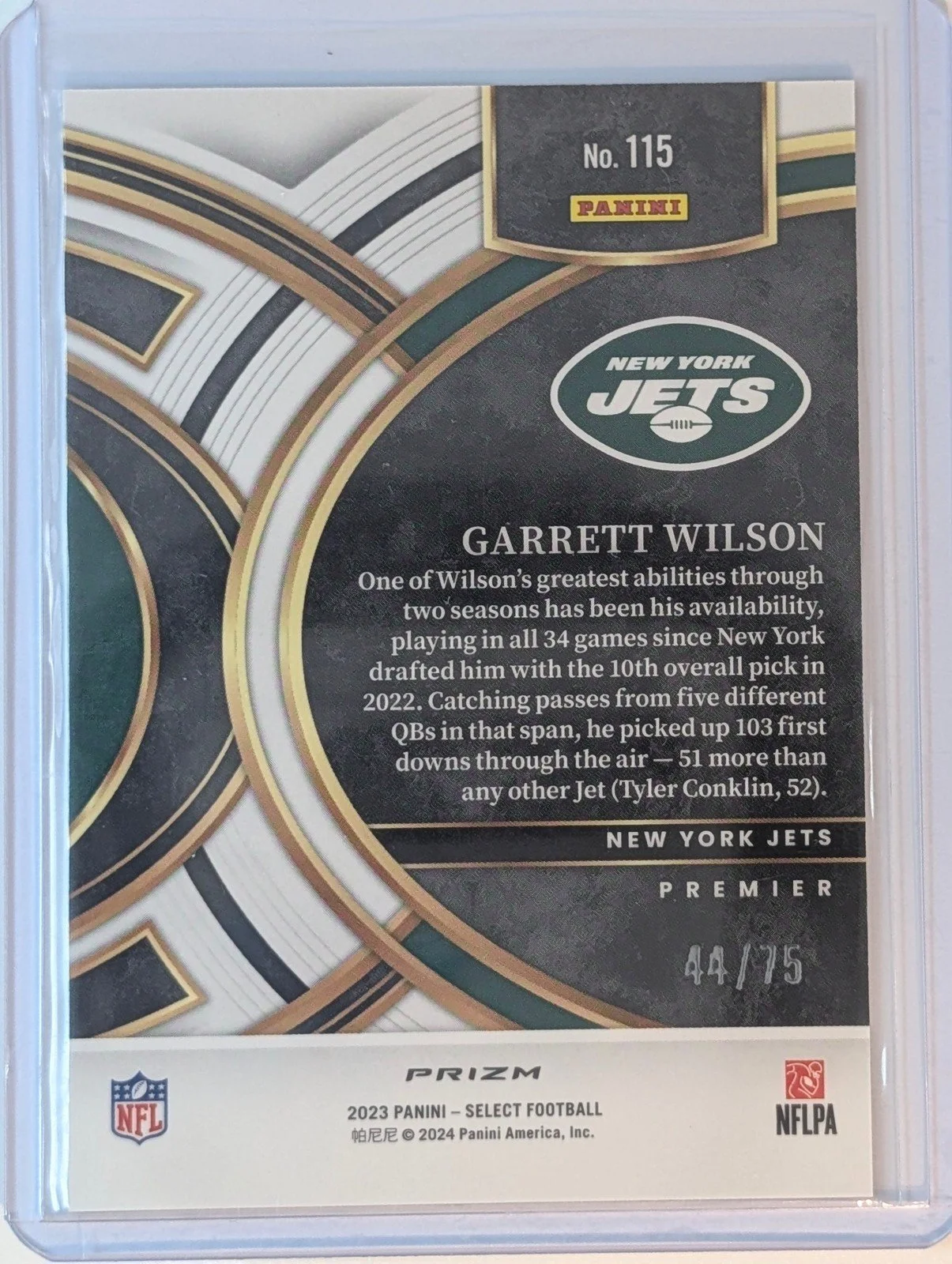 Back of 2023 Panini Select 44/75 #115 Garrett Wilson Purple Prizms /75