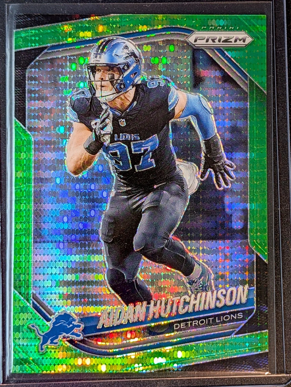 Front of 2025 Panini Prizm #210 Aidan Hutchinson Neon Green Pulsar