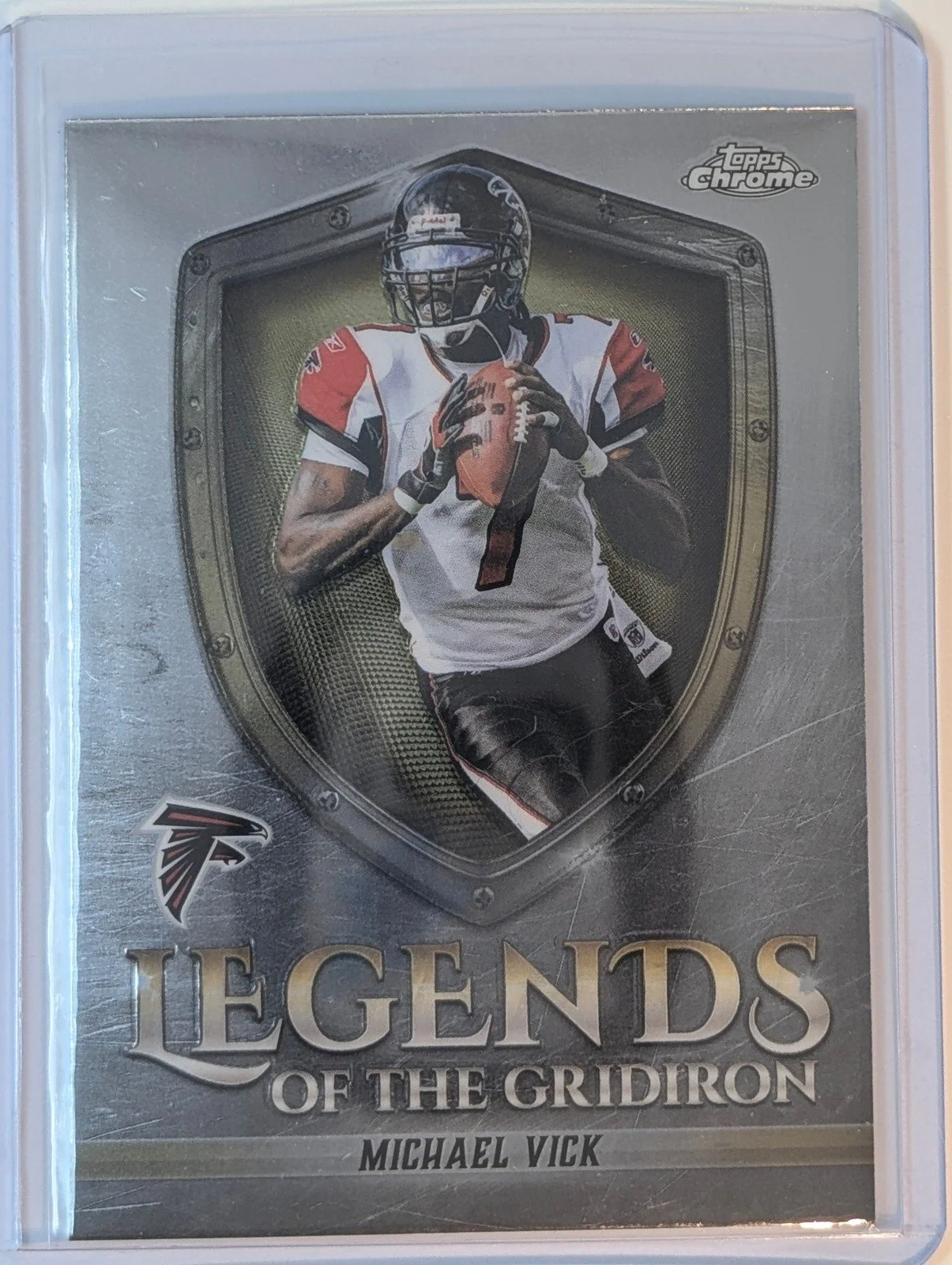 Front of 2025 Topps Chrome #LOG-2 Michael Vick Legends of the Gridiron Refractor