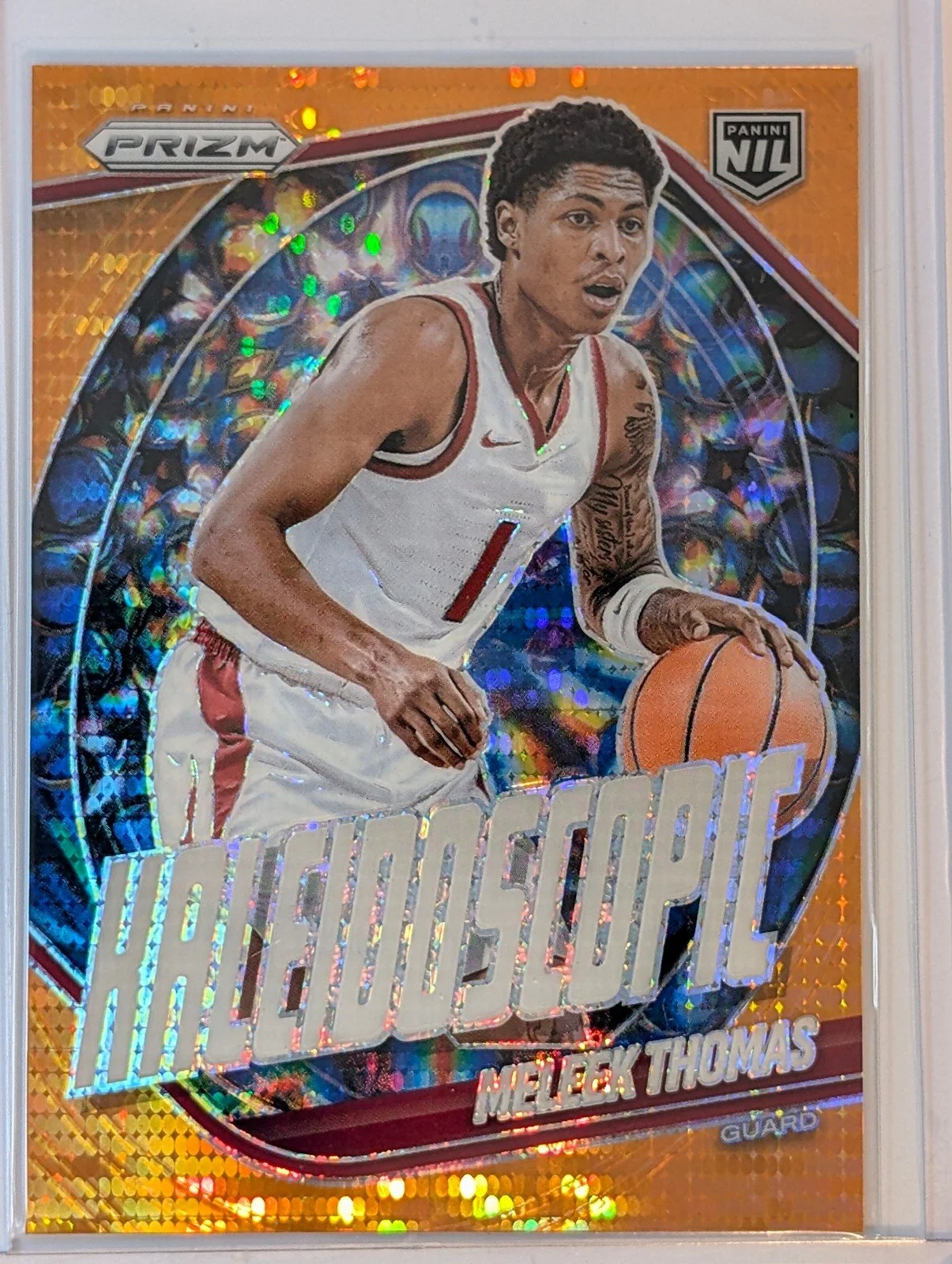 Front of 2025-26 Panini Prizm /149 #21 Meleek Thomas Kaleidescope Orange