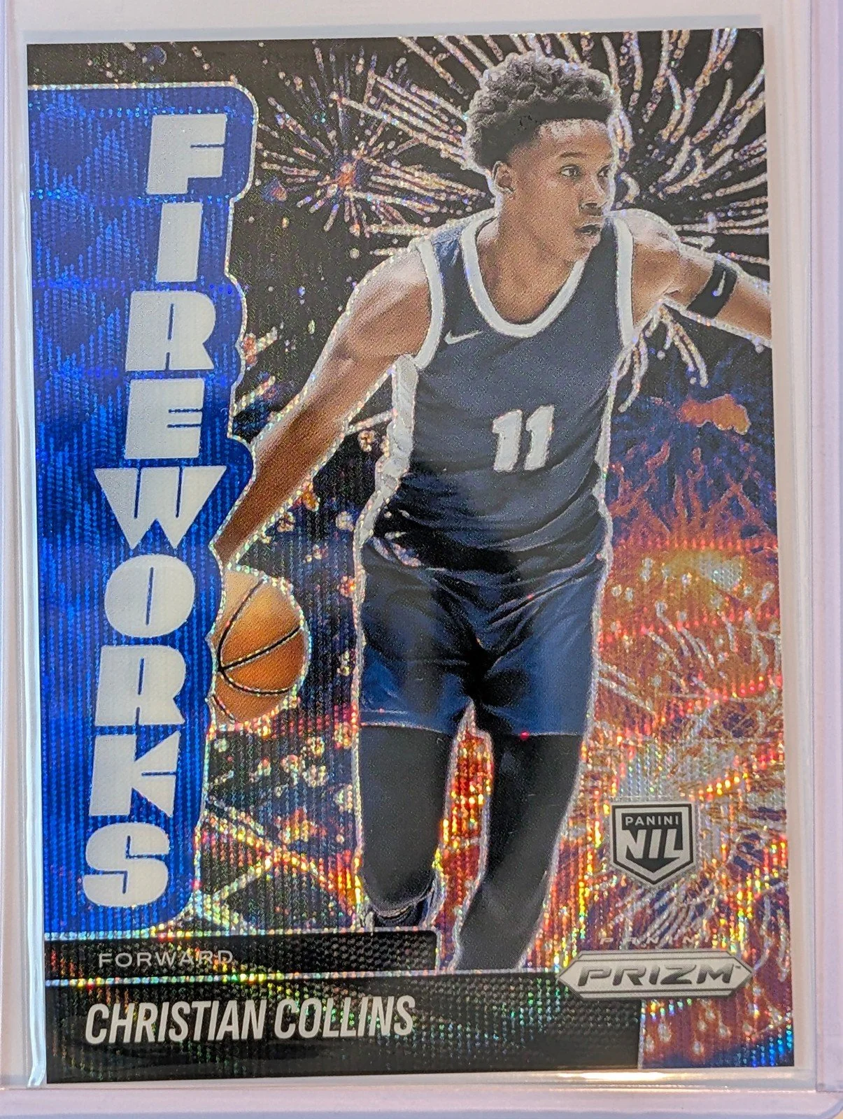 Front of 2025-26 Panini Prizm #13 Christian Collins blue fireworks /249