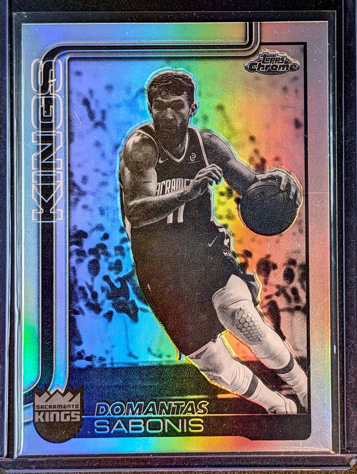 Front of 2025-26 Topps Chrome Update #34 Domantas Sabonis Negative Refractor