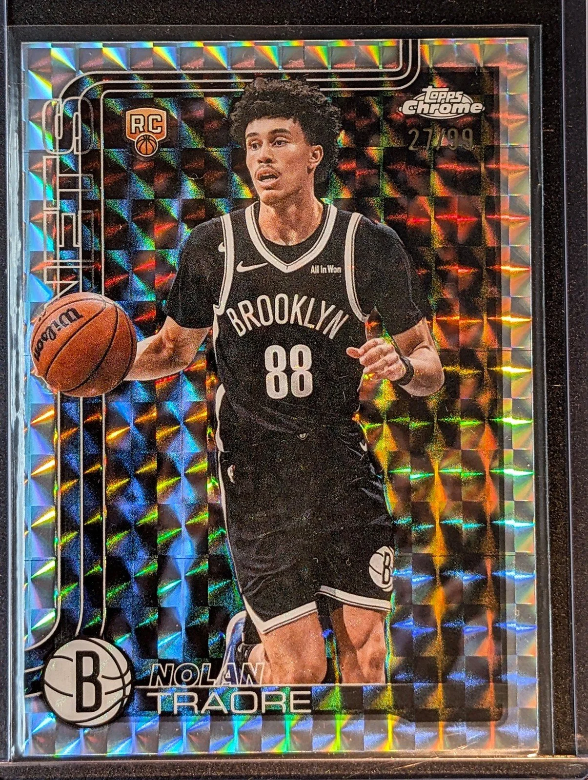 Front of 2025-26 Topps Chrome Update /99 Nolan Traore Geometric Refractor Rookie