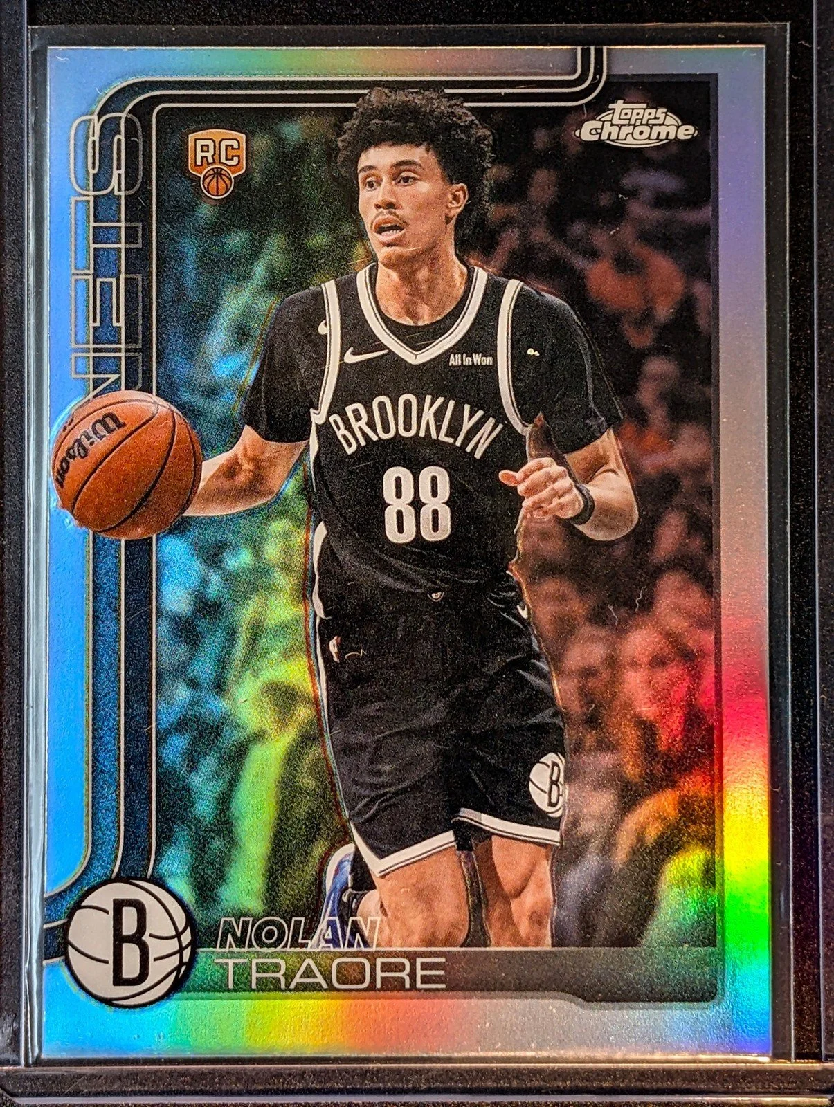Front of 2025-26 Topps Chrome Update #169 Nolan Traore Refractor Rookie