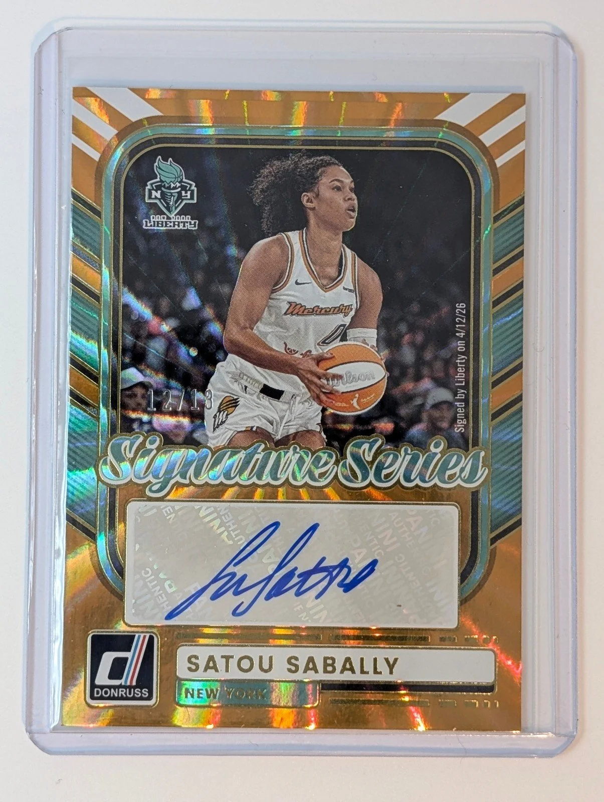 Front of 2026 Donruss WNBA /13 FOTL Satou Sabally Signature Series Orange Laser #SS-SS