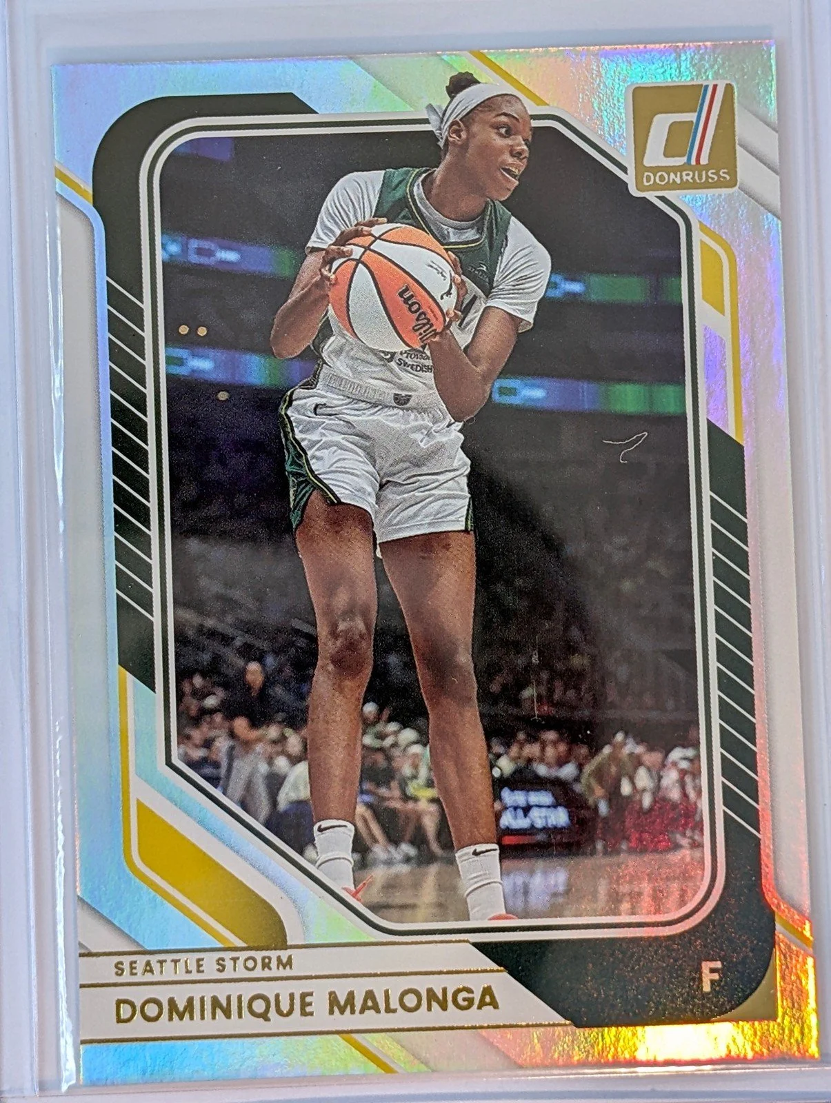 Front of 2026 Panini Donruss WNBA #28 Dominique Malonga Holo