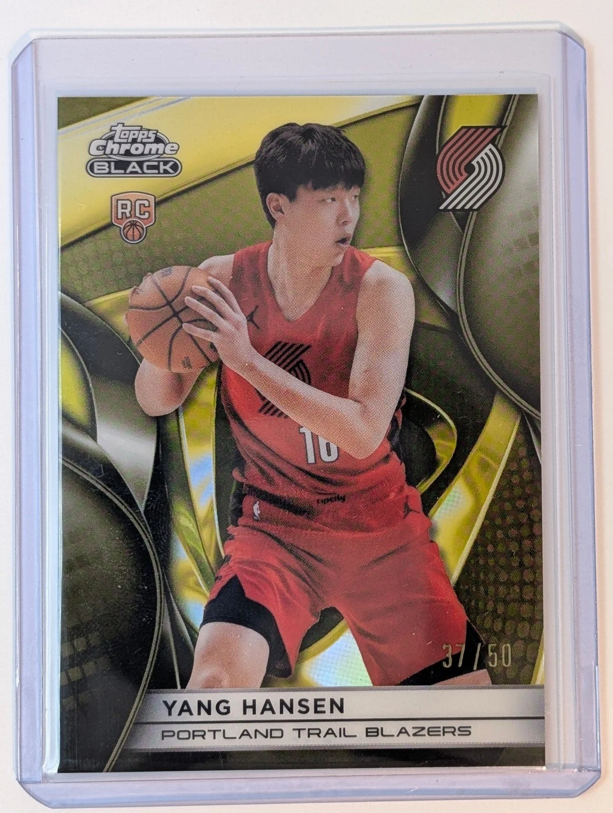 Front of 2025-26 Topps Chrome Black /50 #116 Yang Hansen Gold Refractor RC