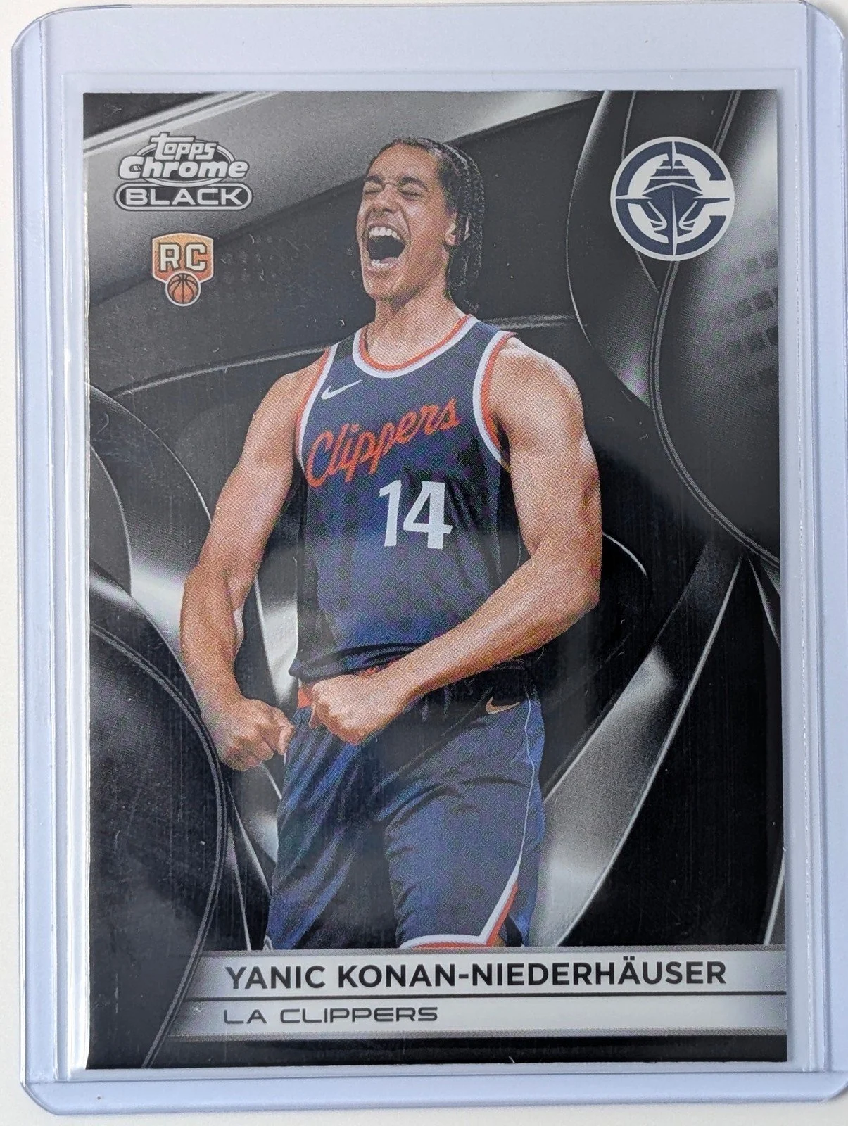 Front of 2025-26 Topps Chrome Black #130 Yanic Konan-Niederhäuser RC