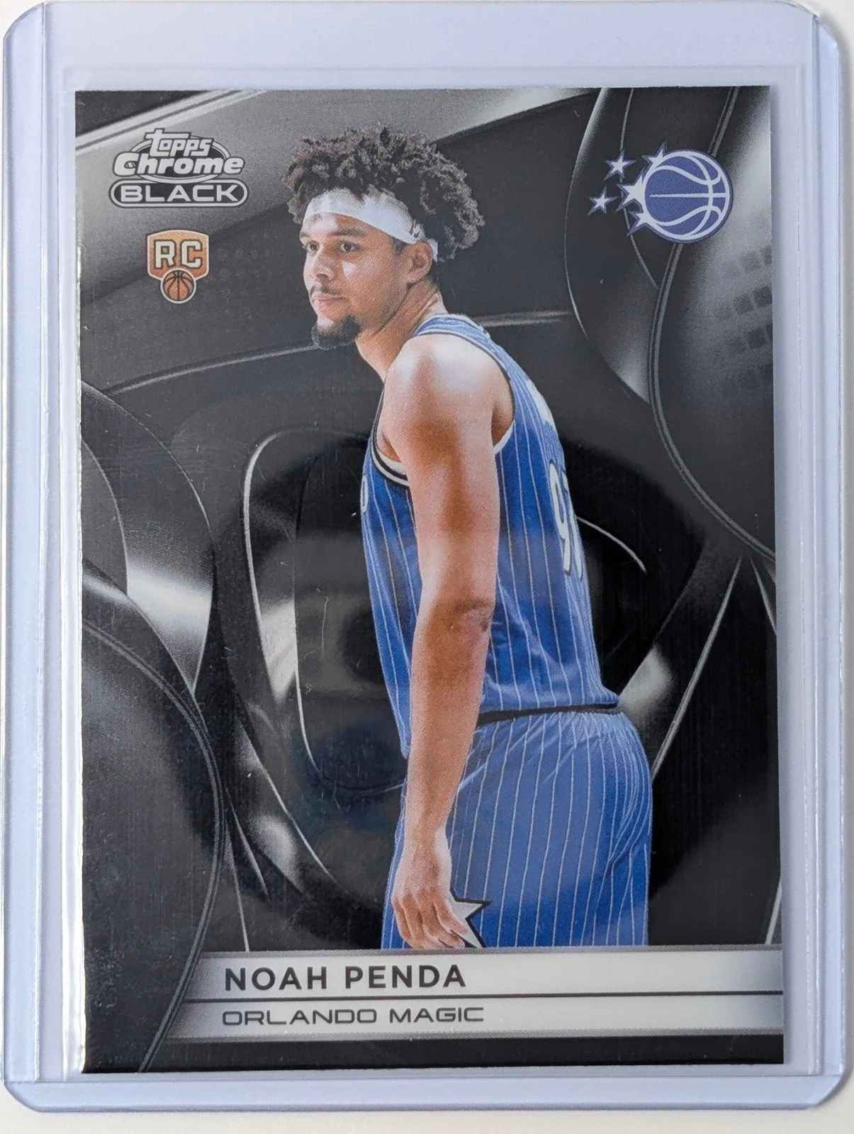Front of 2025-26 Topps Chrome Black #132 Noah Penda RC