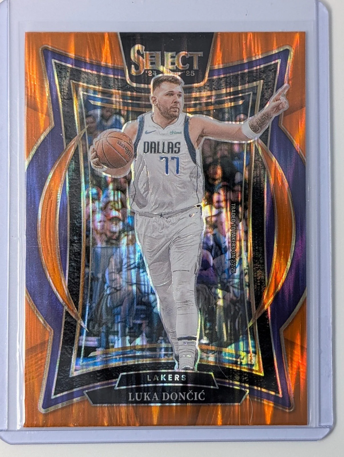 Front of 2024-25 Panini Select #56 Luka Doncic Orange Tectonic Prizm
