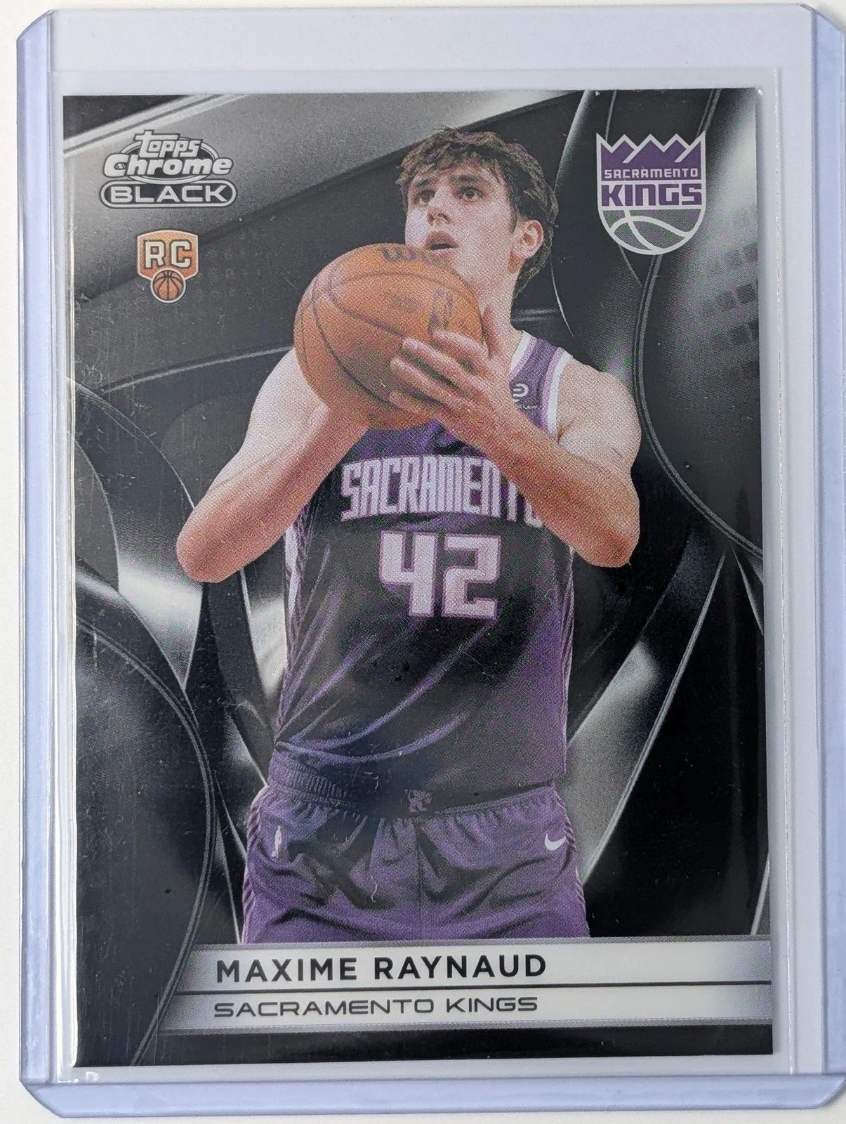 Front of 2025-26 Topps Chrome Black #142 Maxime Raynaud RC