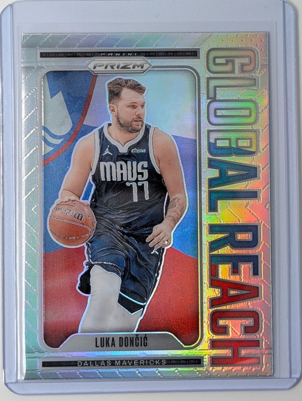 Front of 2024-25 Panini Prizm #8 Luka Doncic Global Reach Prizm Silver