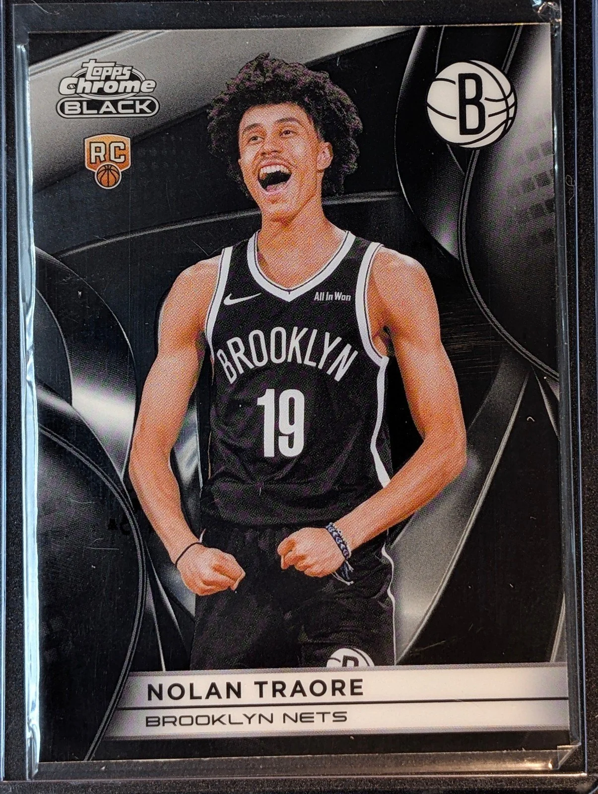 Front of 2025-26 Topps Chrome Black Nolan Traore #119 RC