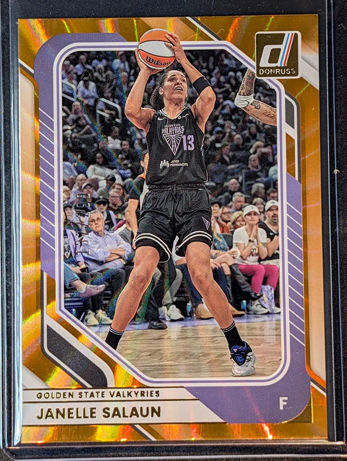 Front of 2026 Panini Donruss WNBA #84 Janelle Salaun Orange Laser /299