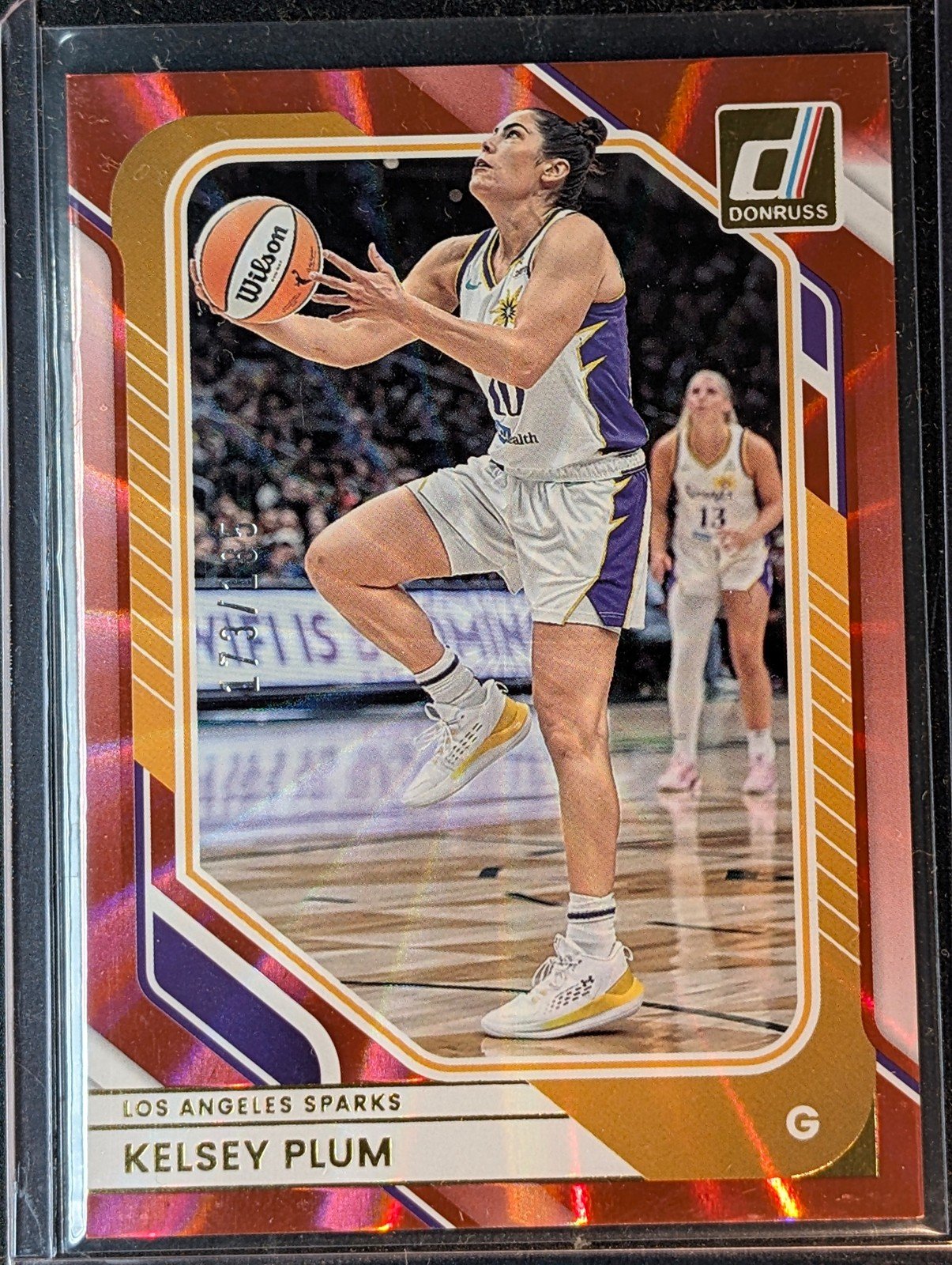 Front of 2026 Panini Donruss WNBA #48 Kelsey Plum Red Laser /185