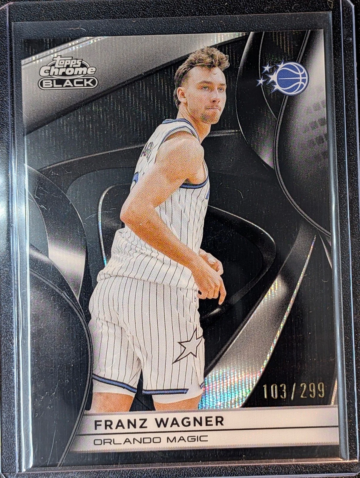 Front of 2025-26 Topps Chrome Black /299 Franz Wagner Refractor #98