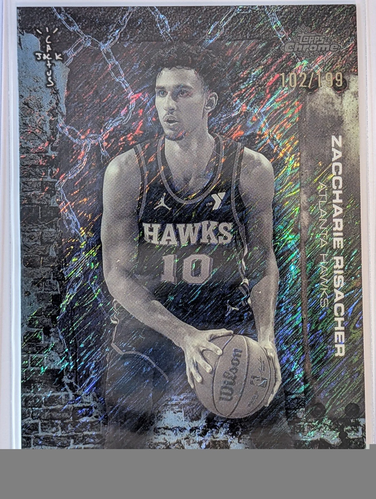 Front of 2025-26 Topps Chrome Cactus Jack /199 #20 Zaccharie Risacher Aqua Shimmer
