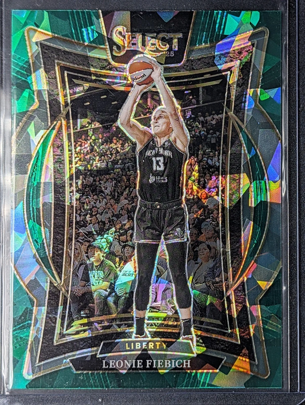 Front of 2025 Panini Select WNBA #79 Leonie Fiebich Green Ice Prizms