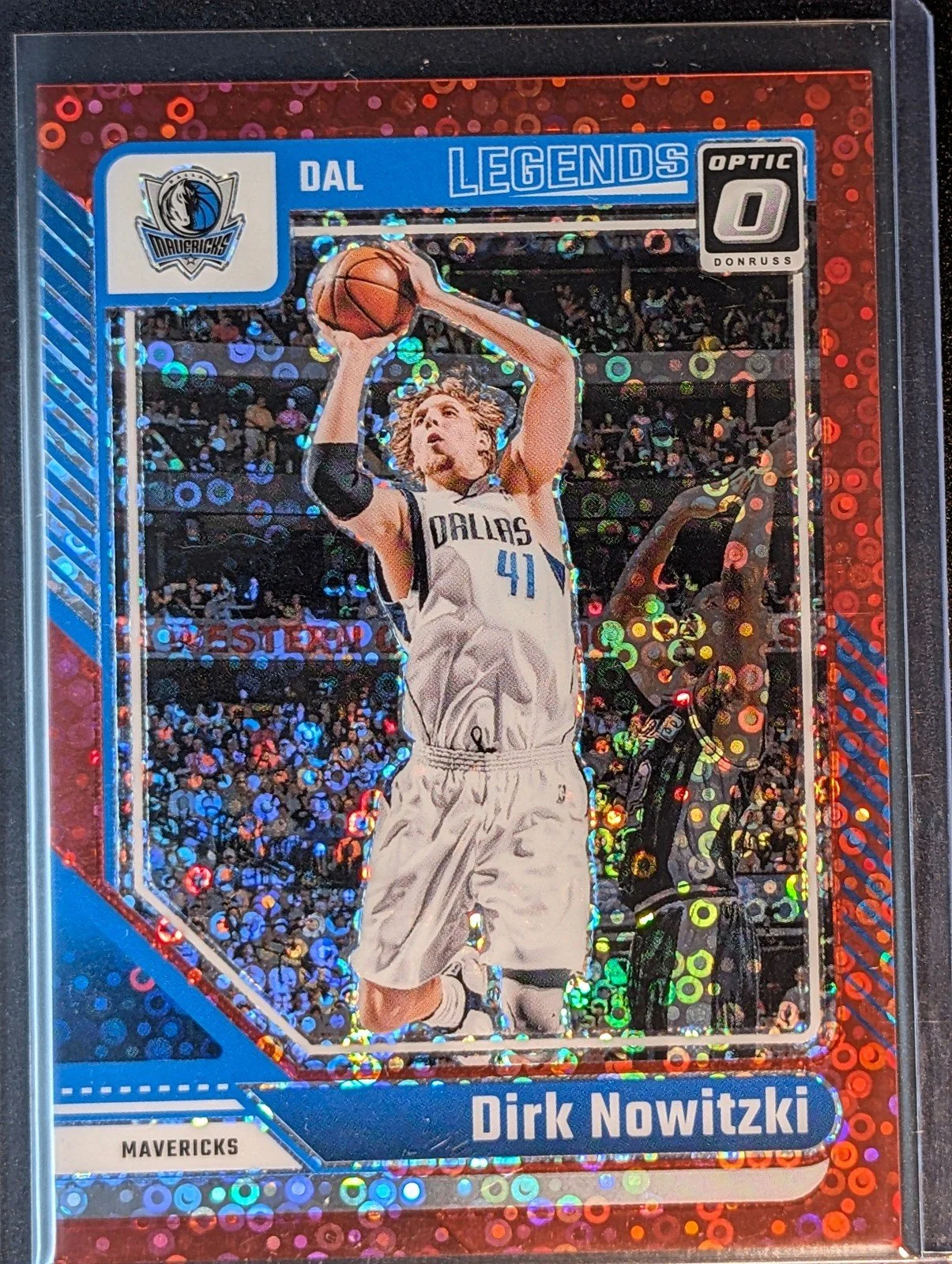 Front of 2024-25 Donruss Optic #247 Dirk Nowitzki Red Glitter #/75