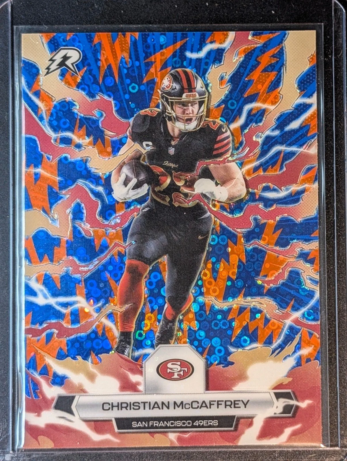 Front of 2025 Topps Resurgence #87 Christian McCaffrey Blue & Orange Spark Refractor