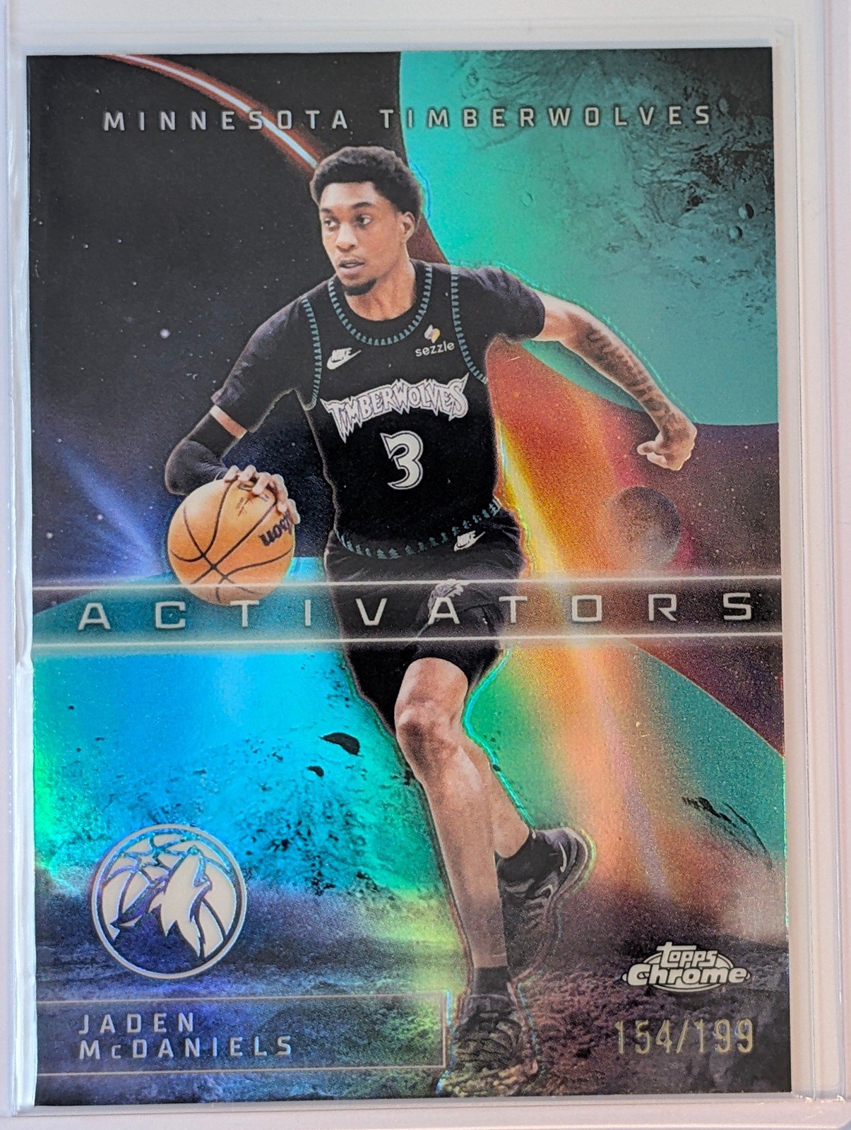 Front of 2025-26 Topps Chrome Update /199 Jaden McDaniels Activators Aqua Refractor