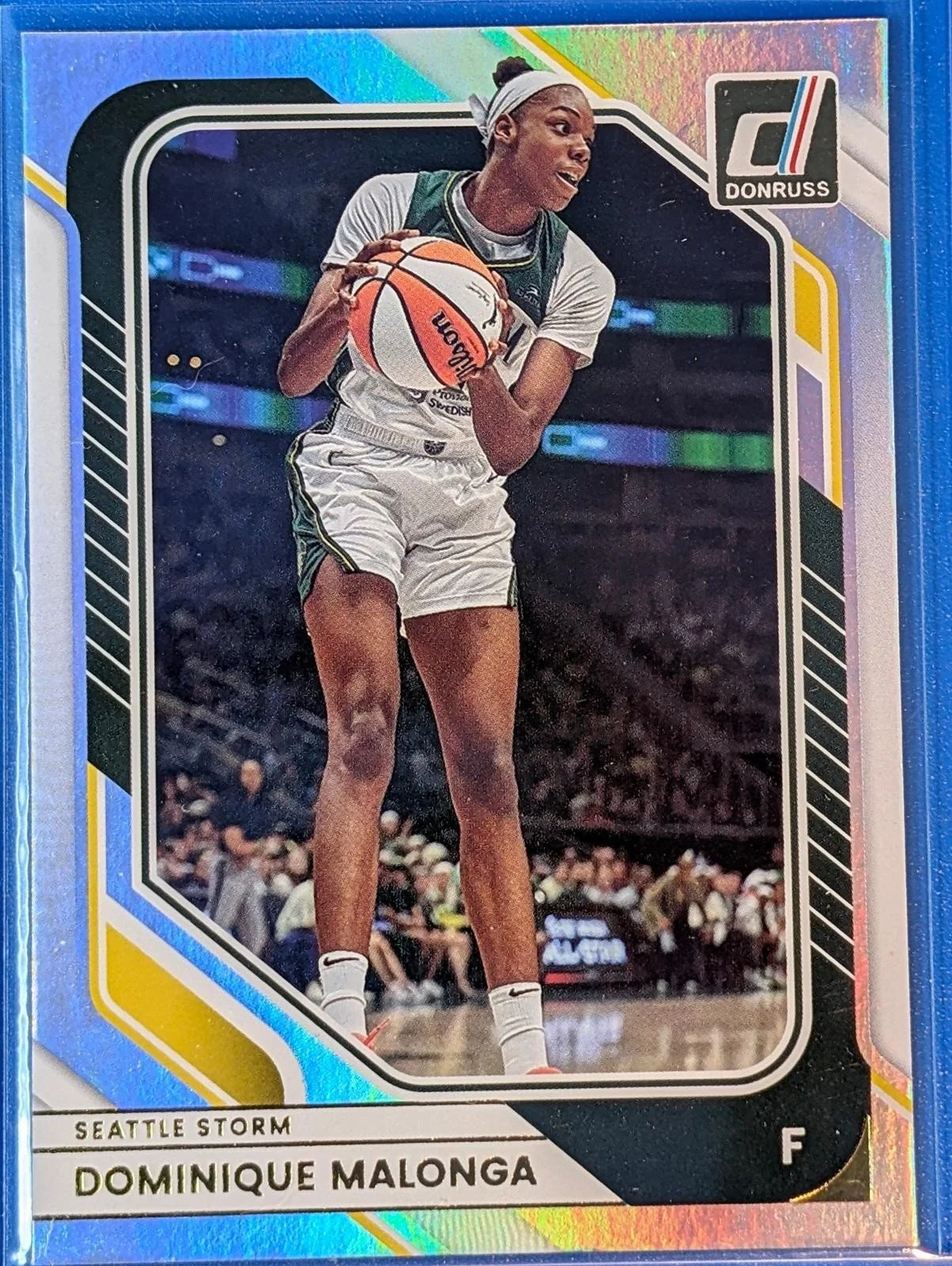 Front of 2026 Panini Donruss WNBA #28 Dominique Malonga Holo