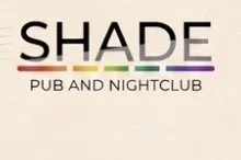 Sign reading 'SHADE PUB AND NIGHTCLUB' with stylized text and colored lines