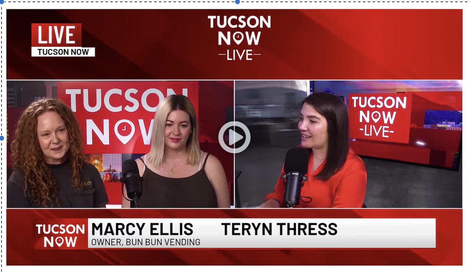 Screenshot from a live television interview on Tucson Now, showing two women and a host discussing a topic. The show features a red and white color scheme with the Tucson Now logo. The women are identified as Marcy Ellis, owner of Bun Bun Vending, and Teryn Thress.