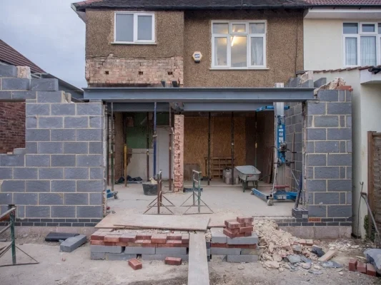 House under renovation with cinder block walls in progress