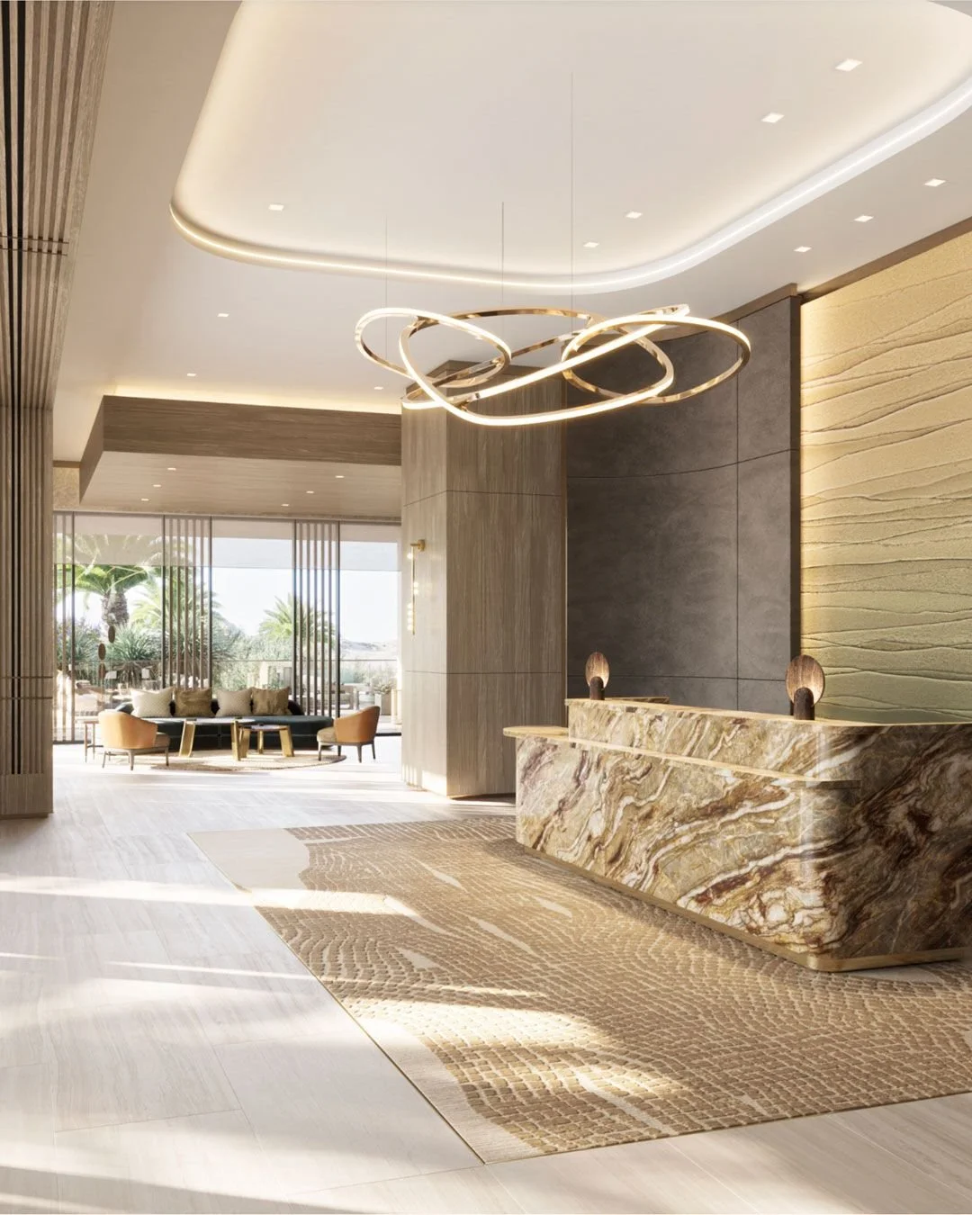Modern hotel lobby with marble front desk, contemporary chandelier, seating area, and large windows with palm trees outside.