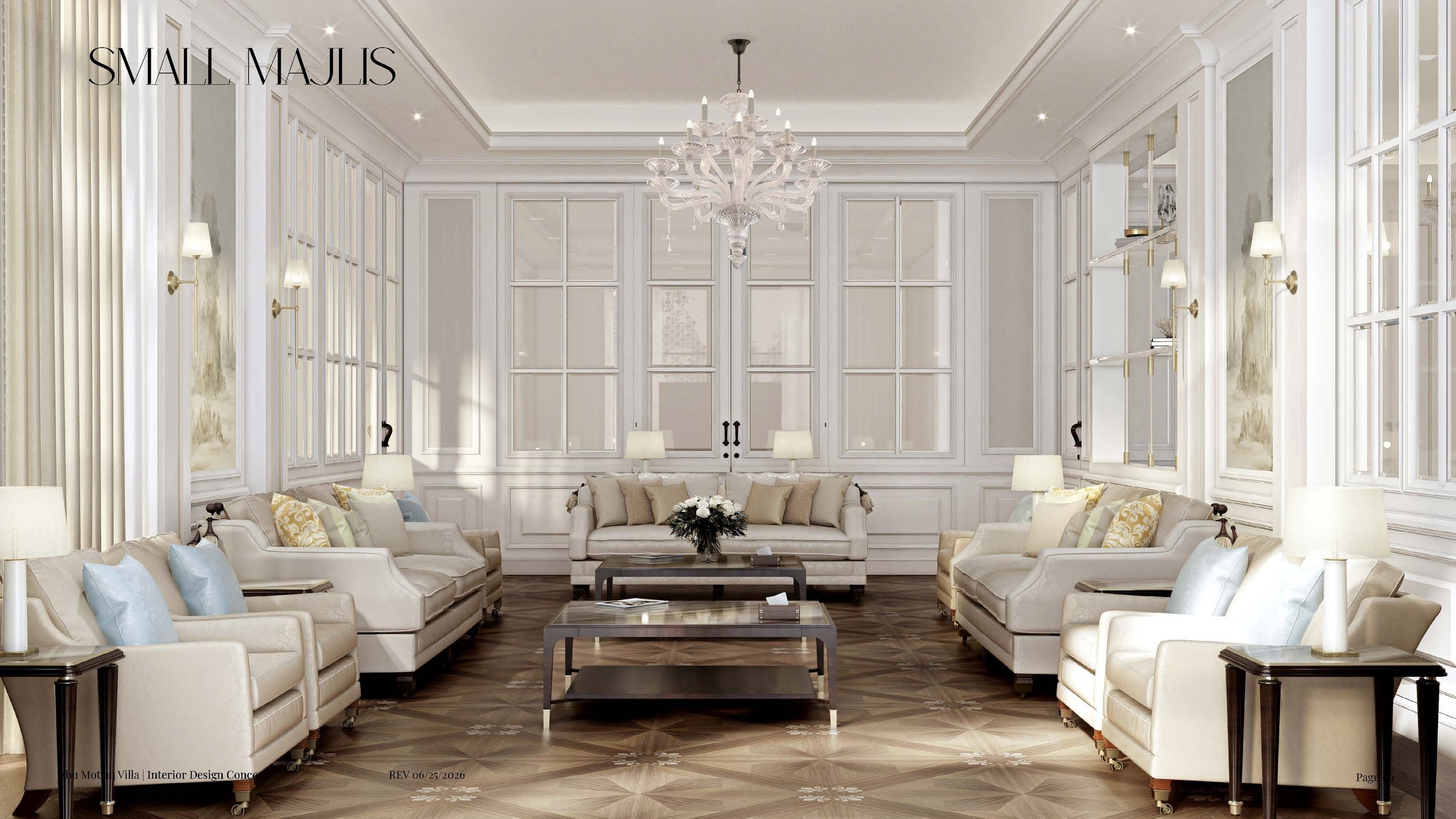 Elegant living room with white paneled walls, high ceilings, and a large crystal chandelier. The room features beige sofas with pastel cushions, a dark wood coffee table with a flower arrangement, and wall-mounted lamps. The flooring is dark wood with a decorative pattern.
