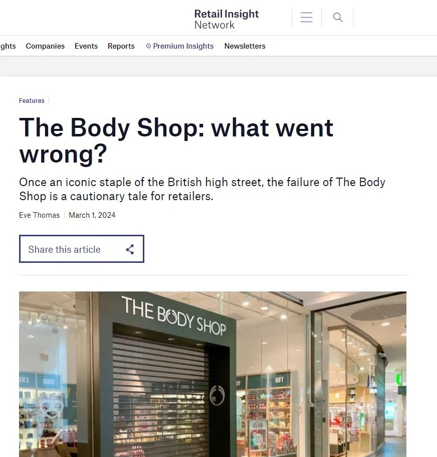 Discontinued Body Shop storefront with a closed shutter in a shopping mall.