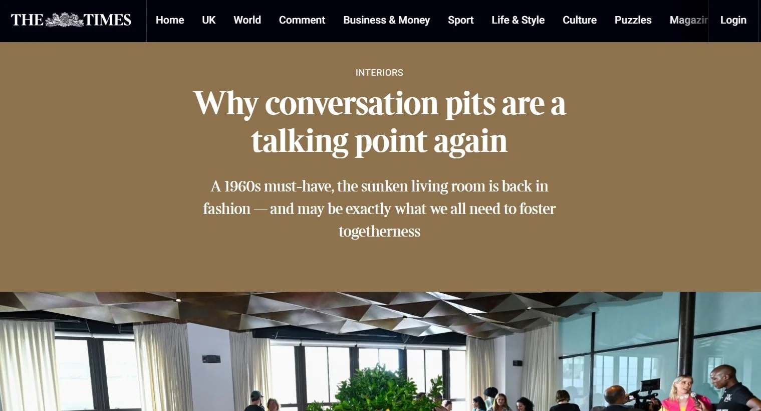A screenshot of a webpage from The Times about conversation pits, featuring a photo of a modern interior with a sunken living room, people sitting and talking, large windows, and contemporary design elements.