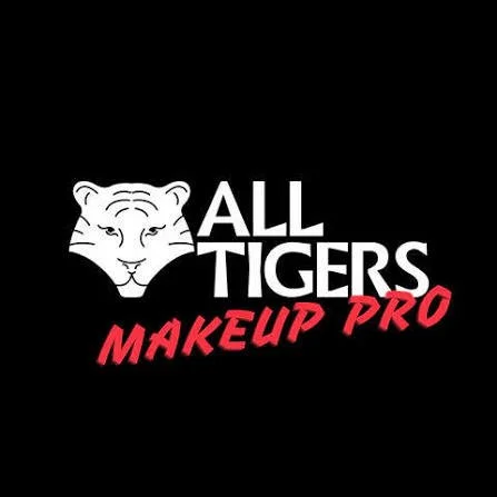 Logo de 'All Tigers Makeup Pro' avec une tête de tigre stylisée et texte en blanc et rouge sur fond noir.