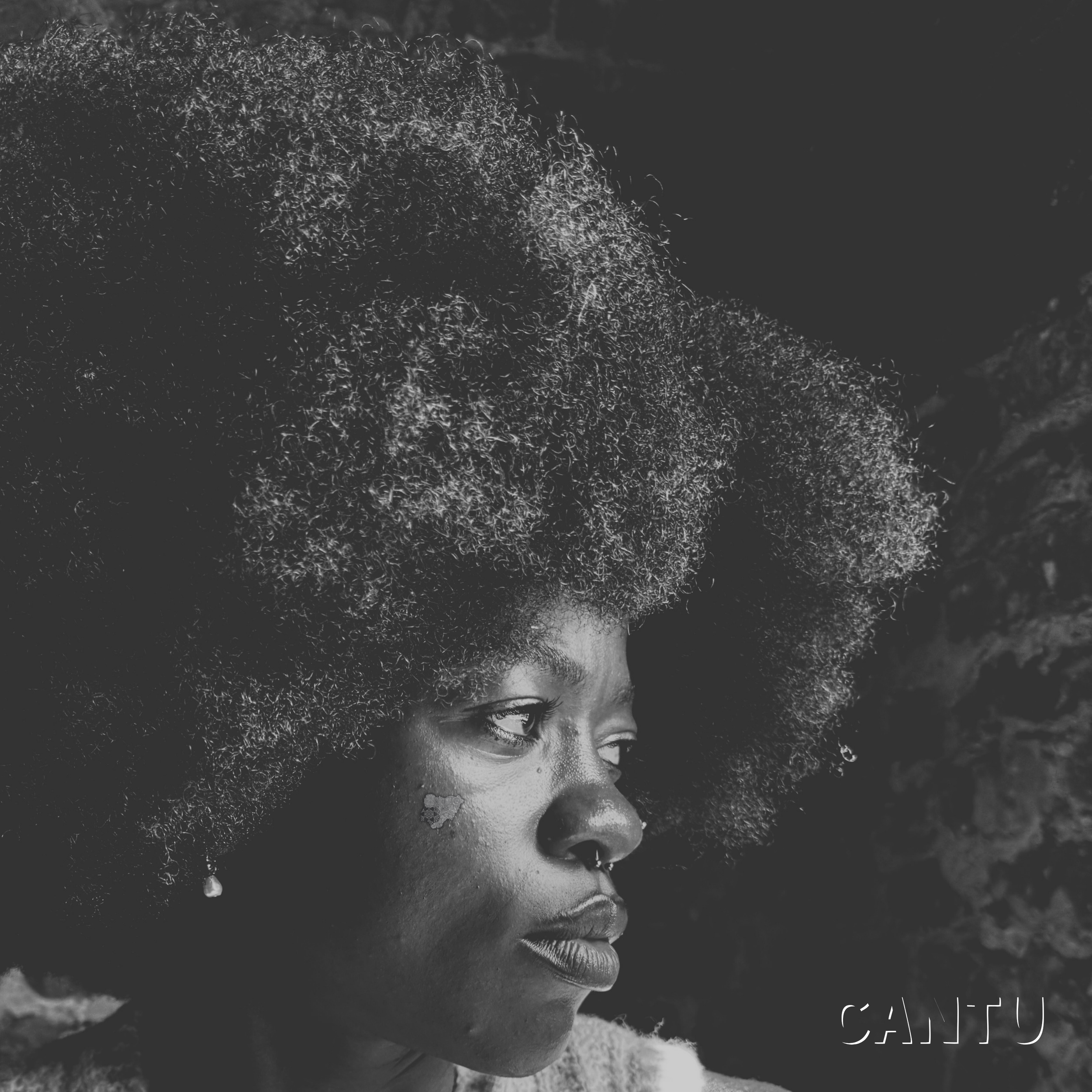 Black and white CANTU single cover featuring artist ARJÉ RAYNE looking to the side with natural afro hair.