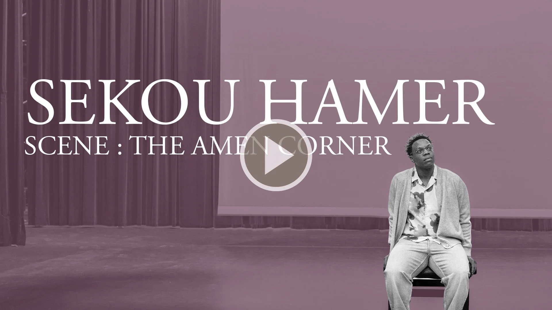 A person sitting on a bench in front of a stage with curtains, with text overlay reading "Sekou Hamer: Scene: The Amen Corner" and a play button in the center.