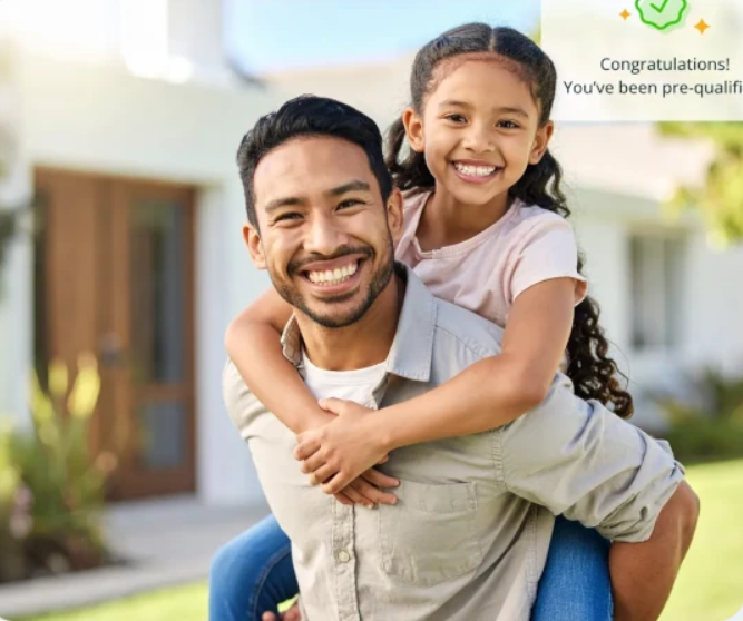 A man giving a piggyback ride to a smiling young girl outdoors in front of a house.