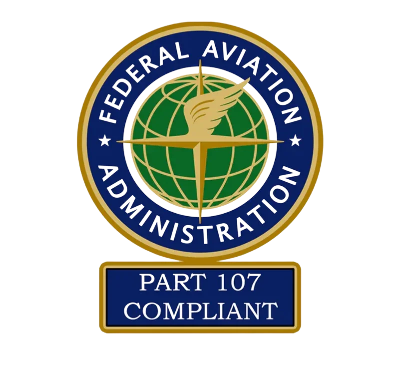U.S. Federal Aviation Administration badge with a globe and a gold winged emblem, marked 'Part 107 Compliant'.