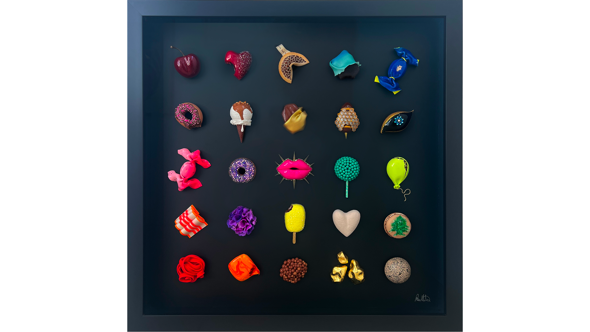 Display case with colorful and decorative candies including cherries, glittery hearts, a giraffe-shaped candy, and various other creatively designed confections.