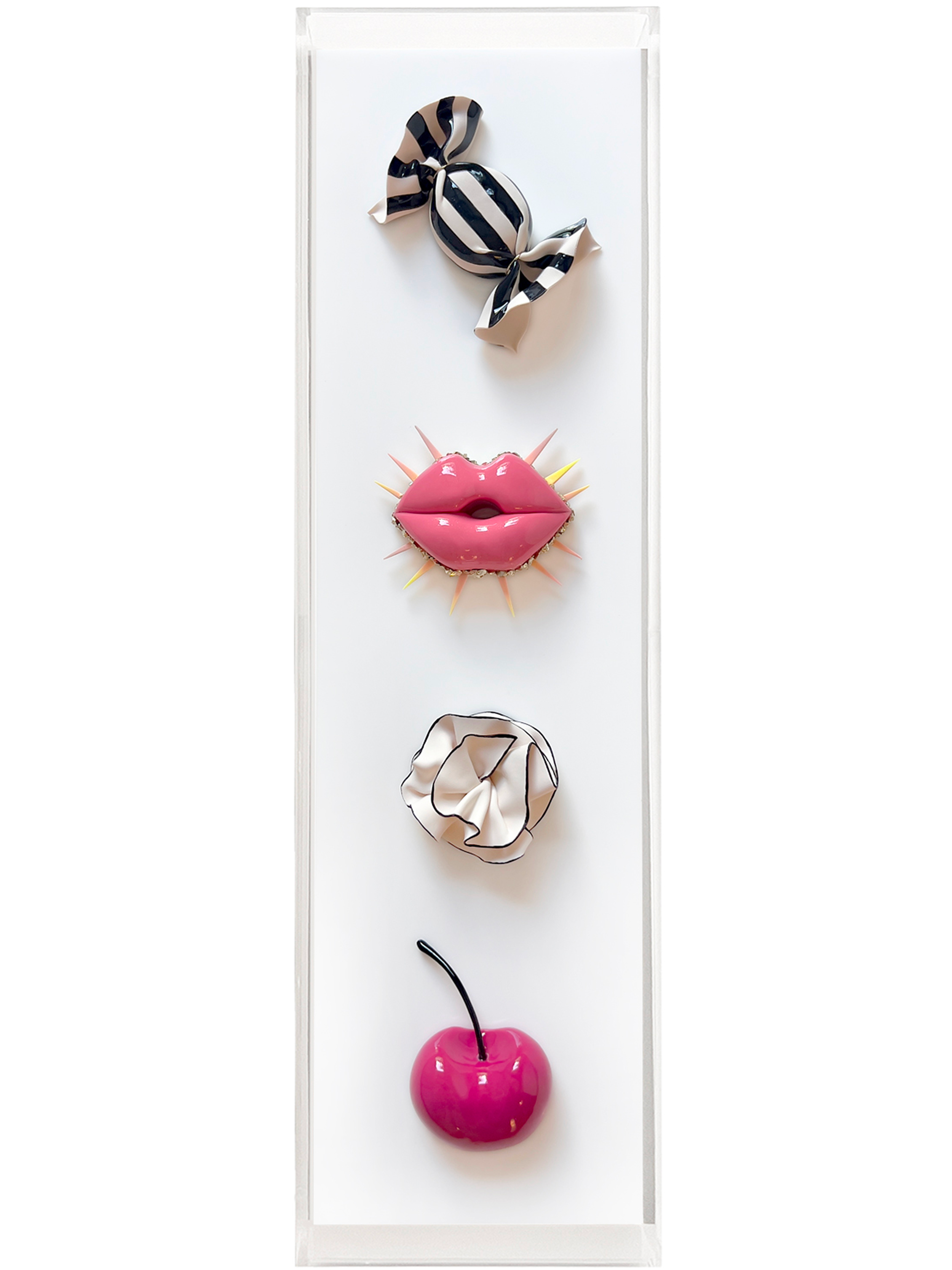 Mixed media art piece featuring a striped ribbon bow at the top, a pair of pink lip-shaped objects with a shiny surface in the middle, and a large pink cherry at the bottom with a black stem, on a white background within a white frame.
