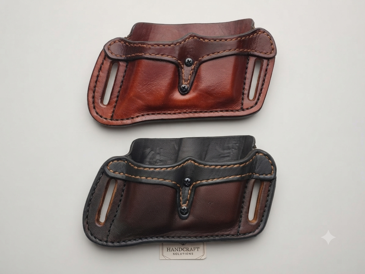Two leather gun holsters, one brown and one black, lying on a white surface.
