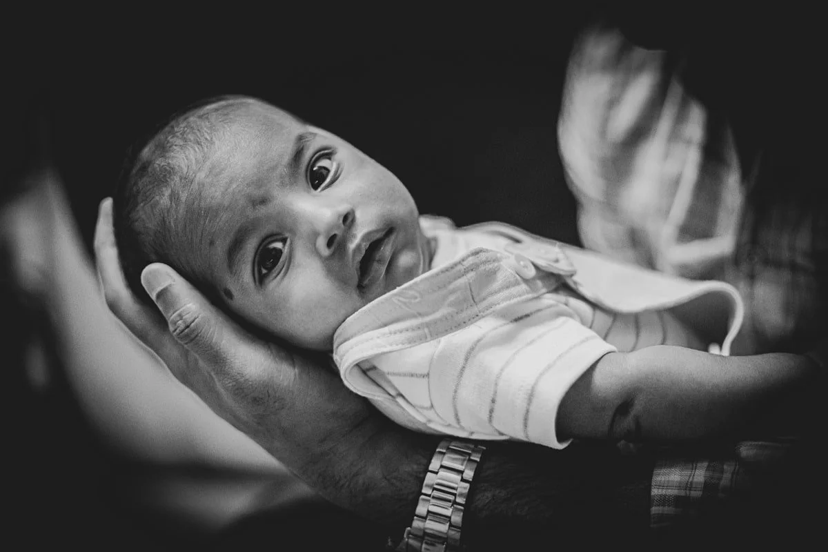 Baby being held