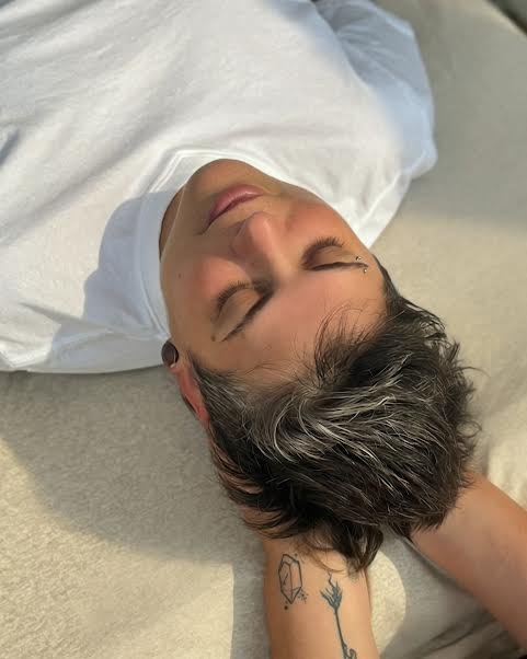 Client relaxing during occipital ridge holds at Rooted Moon Wellness