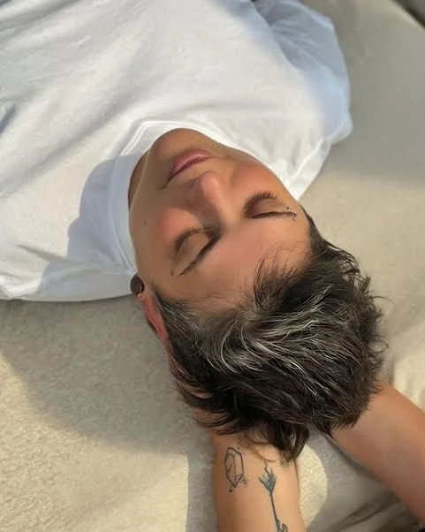 Client relaxing during occipital ridge holds at Rooted Moon Wellness