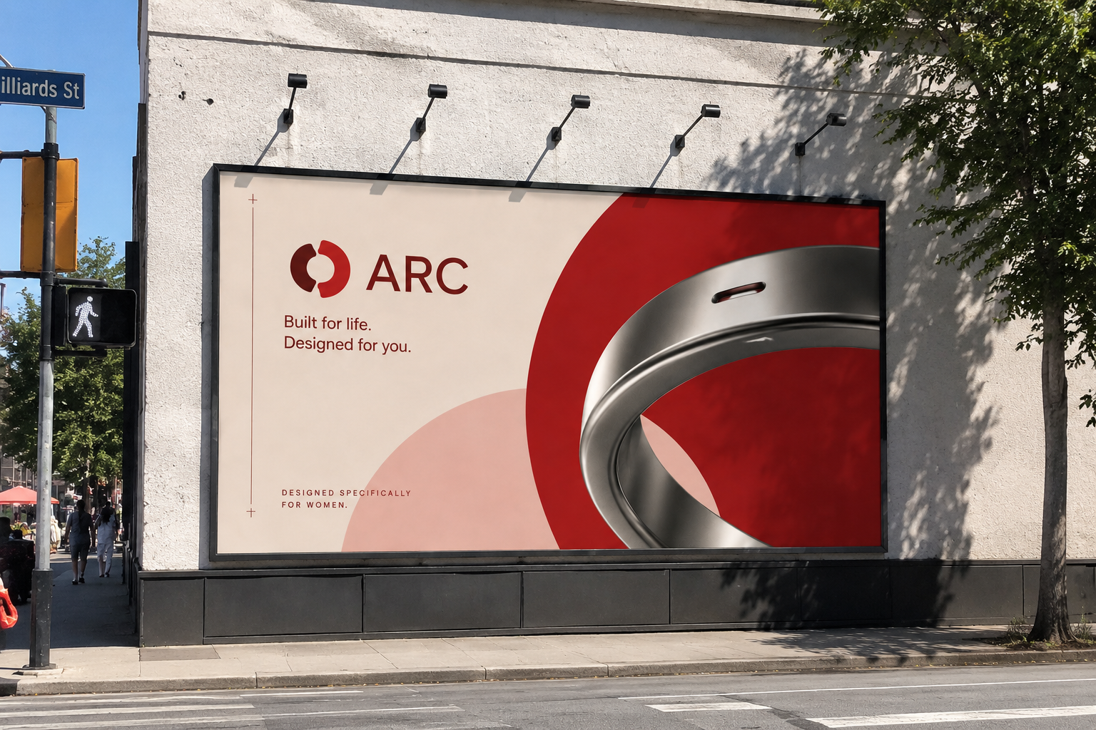 Billboard advertisement for ARC featuring a metallic ring and text that says "Built for life. Designed for you." with smaller text "Designed specifically for women." on a city street.