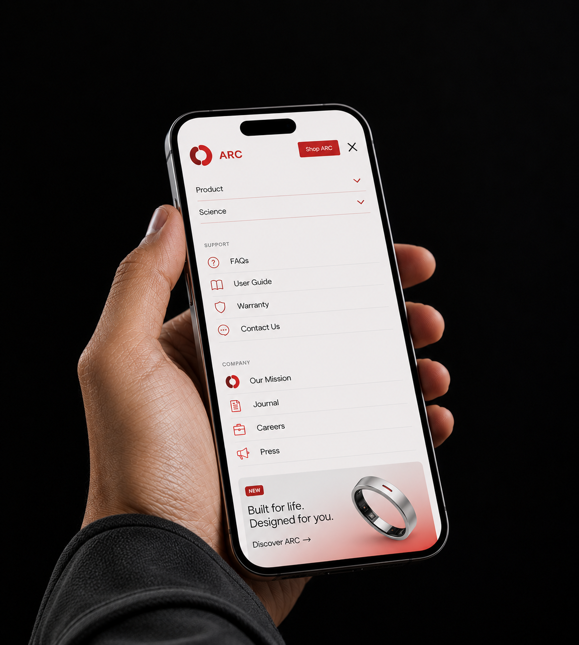 Hand holding a smartphone displaying the ARC website, showing menu options for product, science, support, and company, with a black background.