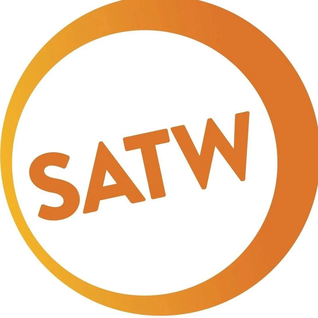 A circular logo with an orange gradient border containing the acronym SATW in the center, tilted slightly counter-clockwise, in bold orange letters.